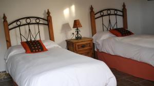 A bed or beds in a room at Habitaciones Sajorami Beach