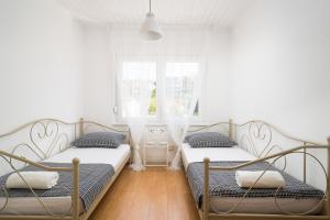Postel nebo postele na pokoji v ubytování Apartman Regius White
