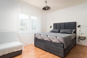 Postel nebo postele na pokoji v ubytování Apartman Regius White