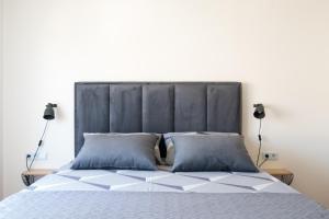 Postel nebo postele na pokoji v ubytování Apartman Regius White