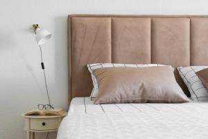 Postel nebo postele na pokoji v ubytování Apartman Regius White