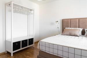 Postel nebo postele na pokoji v ubytování Apartman Regius White