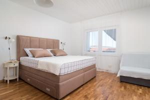 Postel nebo postele na pokoji v ubytování Apartman Regius White
