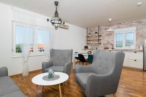 Kuchyň nebo kuchyňský kout v ubytování Apartman Regius White