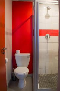 a bathroom with a toilet and a shower stall at 91 Loop Boutique Hostel in Cape Town