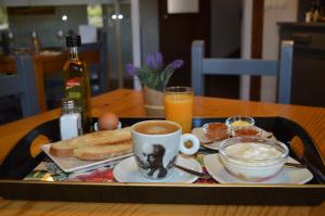 a tray of food with coffee and bread on a table at Santa Brigida - Real 1 in Hontanas