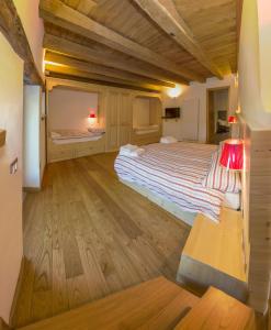 Albergo Diffuso Balcone sul Friuliにあるベッド