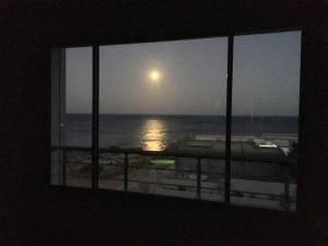 a view of the ocean from a window at Arabesque Style - 2 appartements in Kelibia