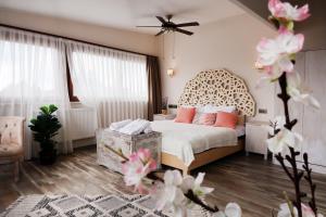 a bedroom with a bed with a leopard print headboard at Fuego Design Suites in Istanbul