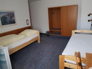 Cama o camas de una habitación en Hotel Gallmersgarten