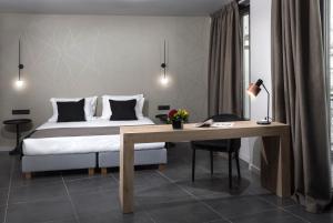 Ein Bett oder Betten in einem Zimmer der Unterkunft Azur Suites