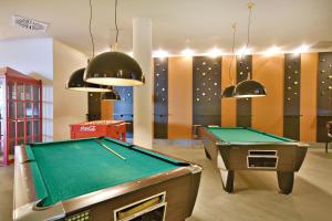 a room with a pool table and ping pong balls at Barceló Teguise Beach - Adults Only in Costa Teguise