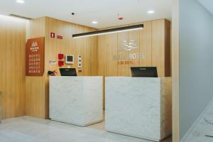 a lobby of a hotel with a reception desk at Masa Hotel 5 de Outubro in Lisbon
