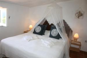 Un pat sau paturi într-o cameră la Agroturistica Villa Mantineo