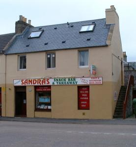a building on the side of a street at Sandras Backpackers in Thurso