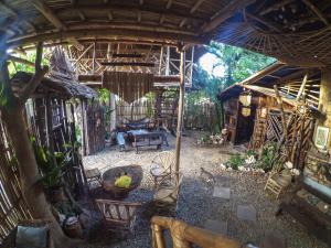 an outside view of a house with a patio at Bamboo Nest in Puerto Princesa City