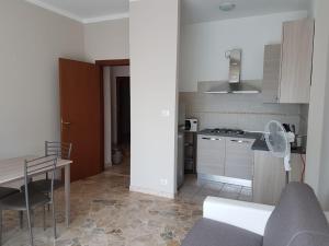 a small kitchen with a table and a stove at CAV Diamond by People in Asti