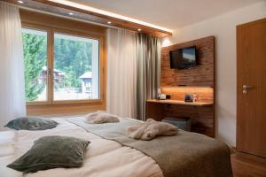 Postel nebo postele na pokoji v ubytování Hotel Hemizeus & Iremia Spa
