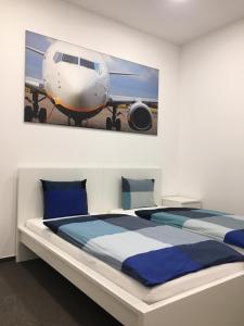 Postel nebo postele na pokoji v ubytování AeroRooms + 20 fotografií