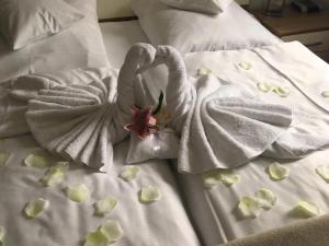 Postel nebo postele na pokoji v ubytování Hotel am Hof