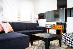 a living room with a couch and a coffee table at Dream LUX Apartments in Kraków