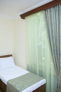 Voodi või voodid majutusasutuse Red Hotel Yerevan Center toas