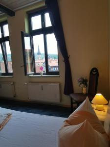 Ein Bett oder Betten in einem Zimmer der Unterkunft Ferienwohnungen Bergstrasse