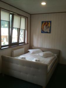 Postel nebo postele na pokoji v ubytování Hotel Galushko