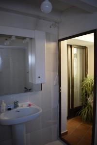 a bathroom with a sink and a mirror at Casa Larrosa rural en Sierra de Guara in Sieso de Huesca +38 photos