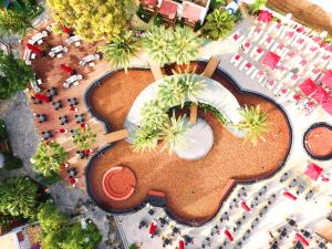 an aerial view of a resort with a pool and palm trees at Very Chic Bodrum Adult Only in Gümbet