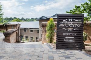 a sign in front of a building at The duBoirs Boutique Guest House in Waterfall