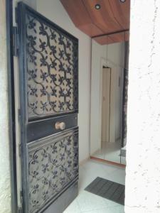 an ornate door in a room with a mirror at Sestiere Dorsoduro Venezia, a due passi dal ponte dei Pugni in Venice