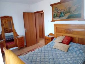 a bedroom with a bed with a blue comforter at Riverside Villa Matka in Skopje +34 photos