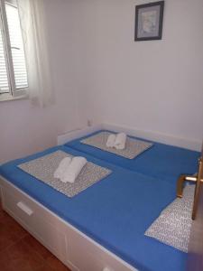 מיטה או מיטות בחדר ב-Apartment Pepi