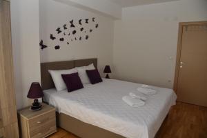 Postel nebo postele na pokoji v ubytování Boda Apartments