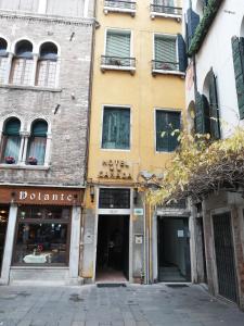 an empty street in front of a building at Hotel Canada in Venice