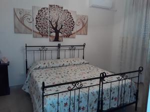 Lova arba lovos apgyvendinimo įstaigoje Elimo Affittacamere - Casa Vacanze di Scardino Leonardo