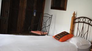 A bed or beds in a room at Habitaciones Sajorami Beach