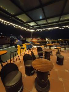 a room with tables and chairs and lights at Bonjour Sa Pa Hotel in Sapa