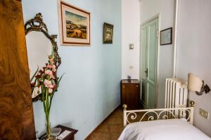 Postel nebo postele na pokoji v ubytování Hotel Il Bargellino