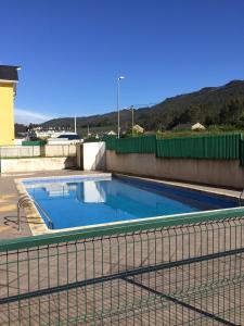an empty swimming pool with a fence around it at Las Catedrales in Barreiros