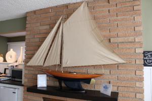 a model of a sail boat on a brick wall at Private Guest Suite in West Los Angeles in Los Angeles