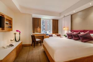 Postel nebo postele na pokoji v ubytování Concorde Hotel New York