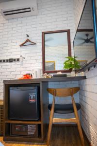 TV a/nebo společenská místnost v ubytování Carnarvon Suites By Reunion