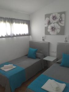 A bed or beds in a room at Santa Barbara by Placida Mar