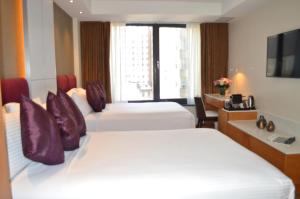 Postel nebo postele na pokoji v ubytování Concorde Hotel New York