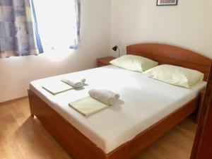 Postel nebo postele na pokoji v ubytování Apartments Nautic