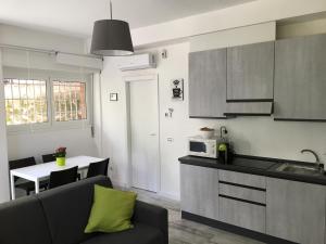 A kitchen or kitchenette at OASI METROPOLITANA Apartment