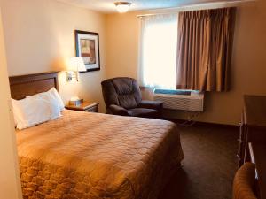 Voodi või voodid majutusasutuse Shenandoah Inn & Suites toas