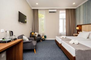 Postel nebo postele na pokoji v ubytování Margi Boutique Hotel by DNT Group + 37 fotografií